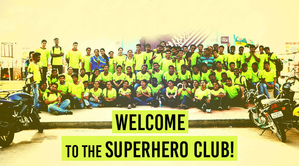 Prayag volunteers gathered together in superhero club shirts